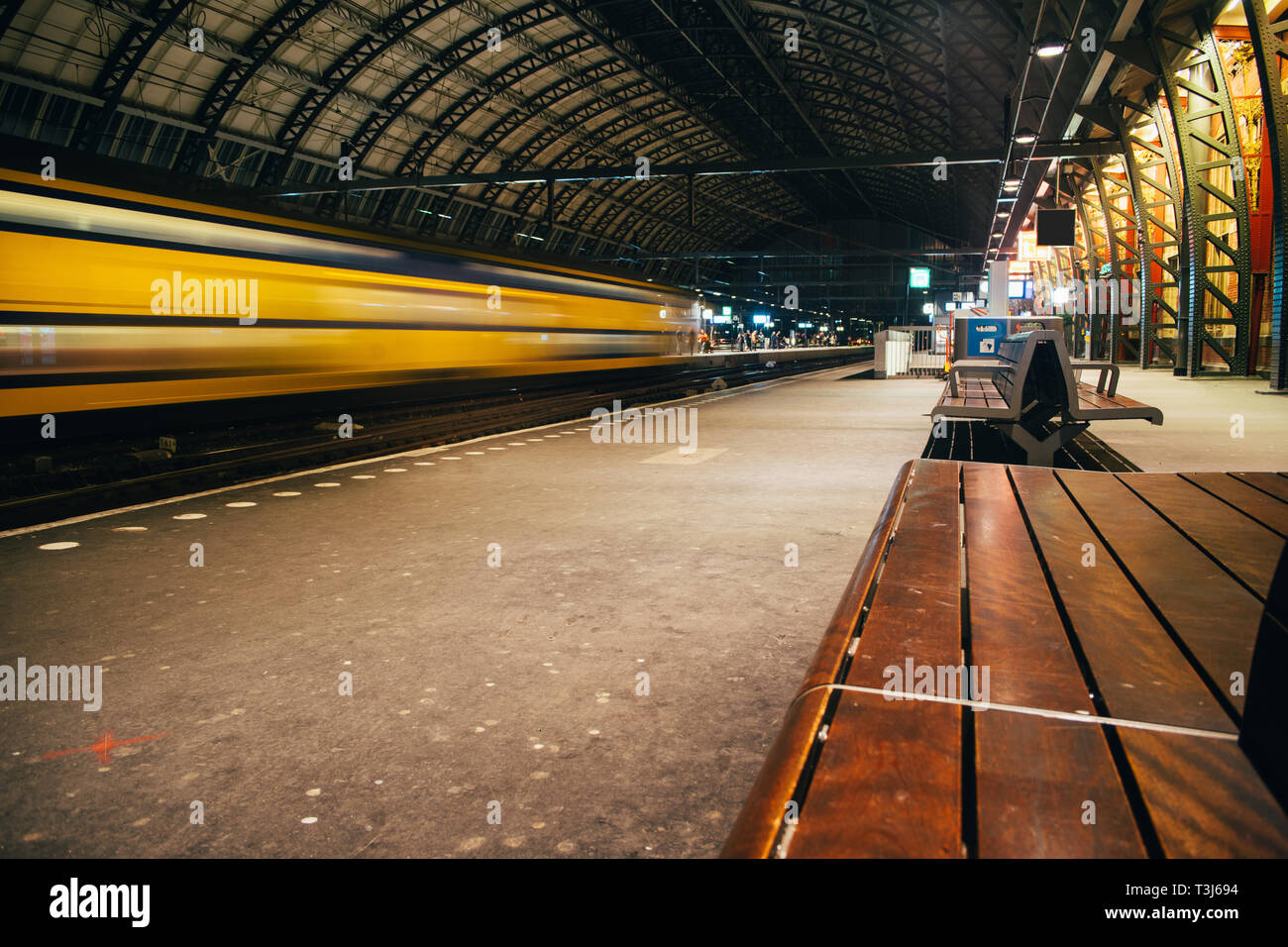 Blurred train motion with high speed at railway station Stock Photo