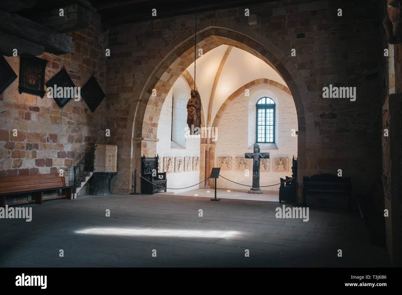 Catholic church interior with medieval walls and arch designed construction. Holy cross and gothic architecture Stock Photo