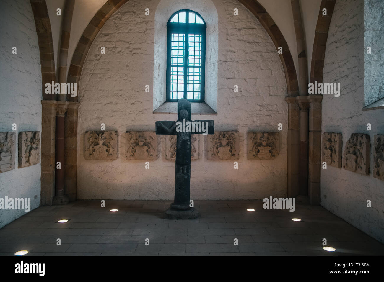 Catholic church interior with medieval walls and arch designed construction. Holy cross and gothic architecture Stock Photo