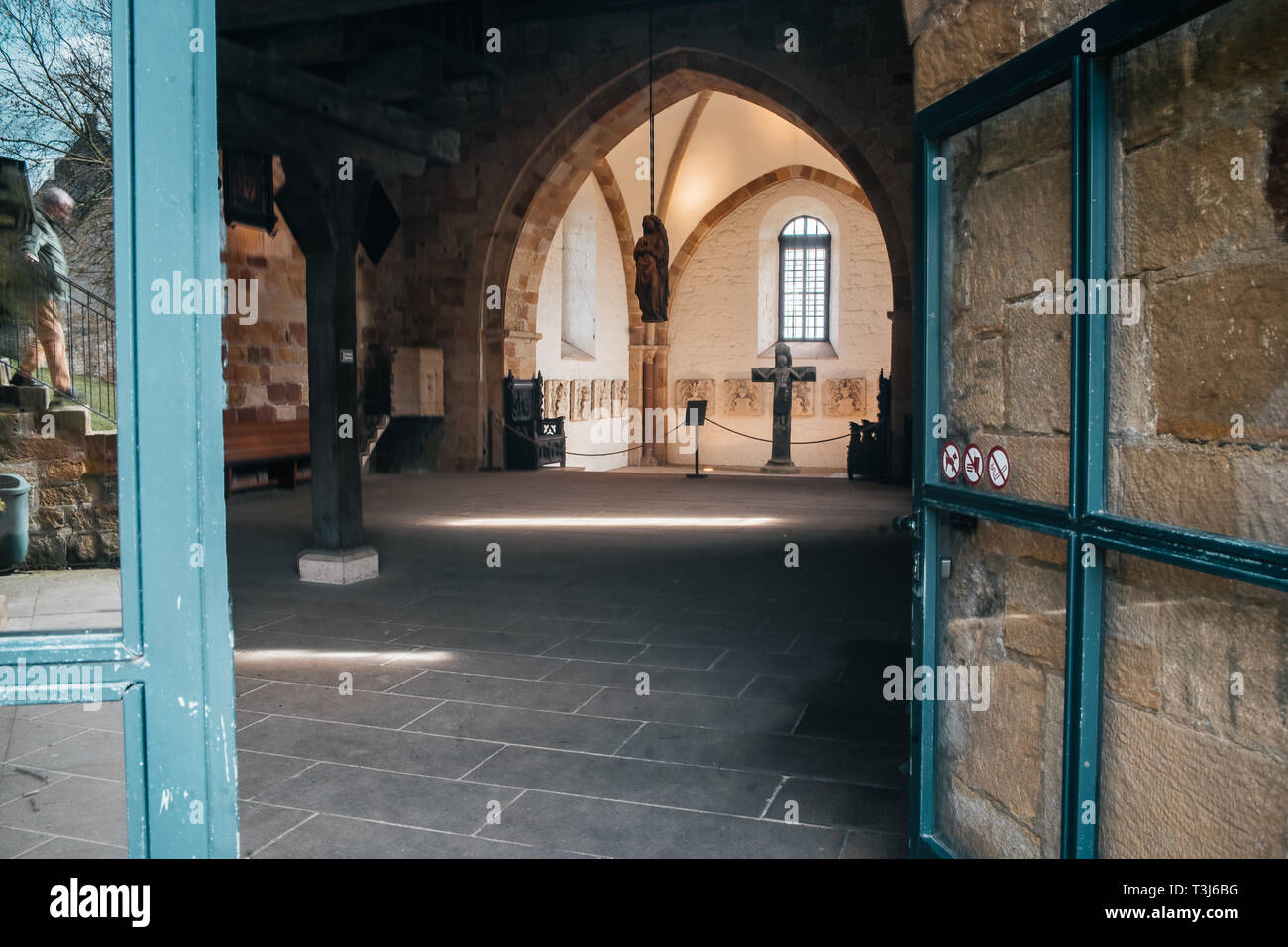 Catholic church interior with medieval walls and arch designed construction. Holy cross and gothic architecture Stock Photo