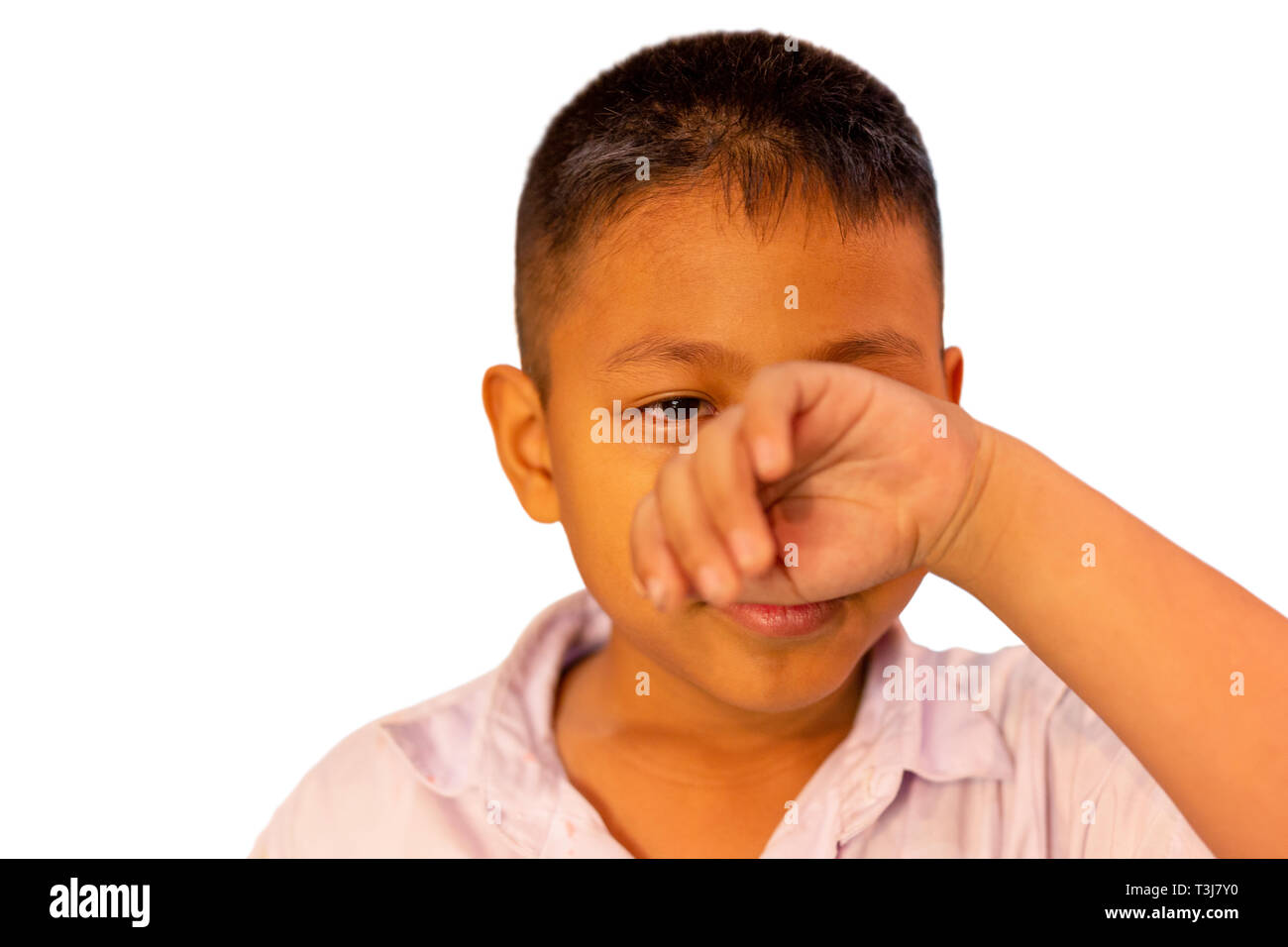 Portrait of asian boy crying with his hand cover his face in clippinh path. Stock Photo