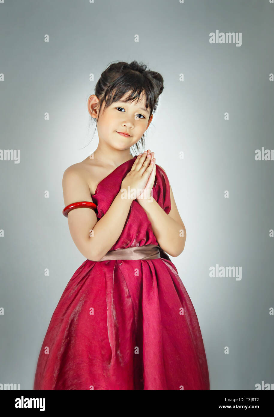 Portrait of asian little girl in red dress Stock Photo - Alamy