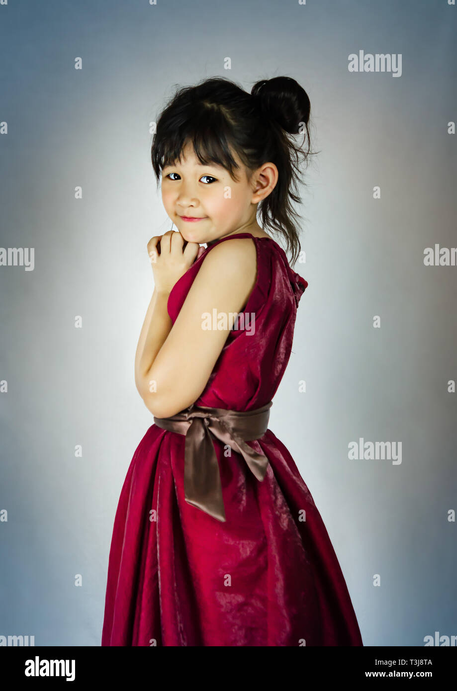 Portrait of asian little girl in red dress Stock Photo - Alamy