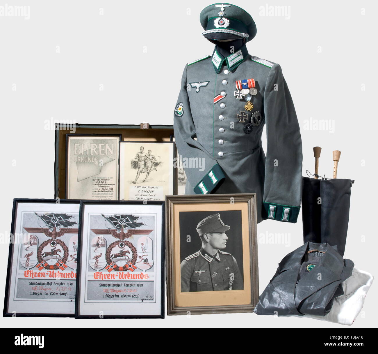 Uniform pieces, decorations, and certificates, for a Lieutenant in the 99th  Gebirgsjäger Regiment A visor cap of fine, field grey gabardine with dark  green cap band, green piping, and silver-embroidered insignia. A
