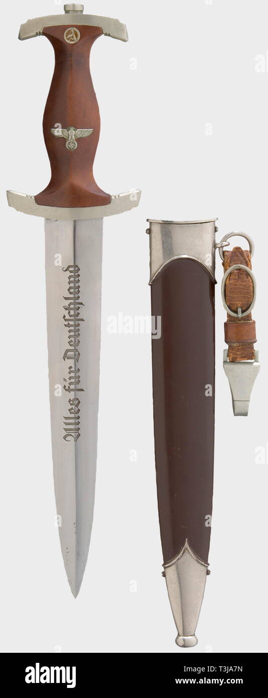 An SA model 33 service dagger, engraved in memory of a combat veteran of Russia Blade etched with the motto 'Alles für Deutschland', and with the dedication, 'SA-Obertruppführer Adolf Schneemann - SA-Standarte 15 - Gefallen am 13. August 1941 bei Marinjitzi/Russland' (SA-Obertruppführer Adolf Schneemann - SA-Standarte 15 - Killed in Action on 13 August 1944 at Marinjitzi/Russia). Nickel-silver quillons marked 'Ha' for the Hansa Group. Brown wooden grip with both emblems. Relacquered scabbard with nickel-plated mountings. Brown leather suspension. Length 34.5 cm. historic, h, Editorial-Use-Only Stock Photo
