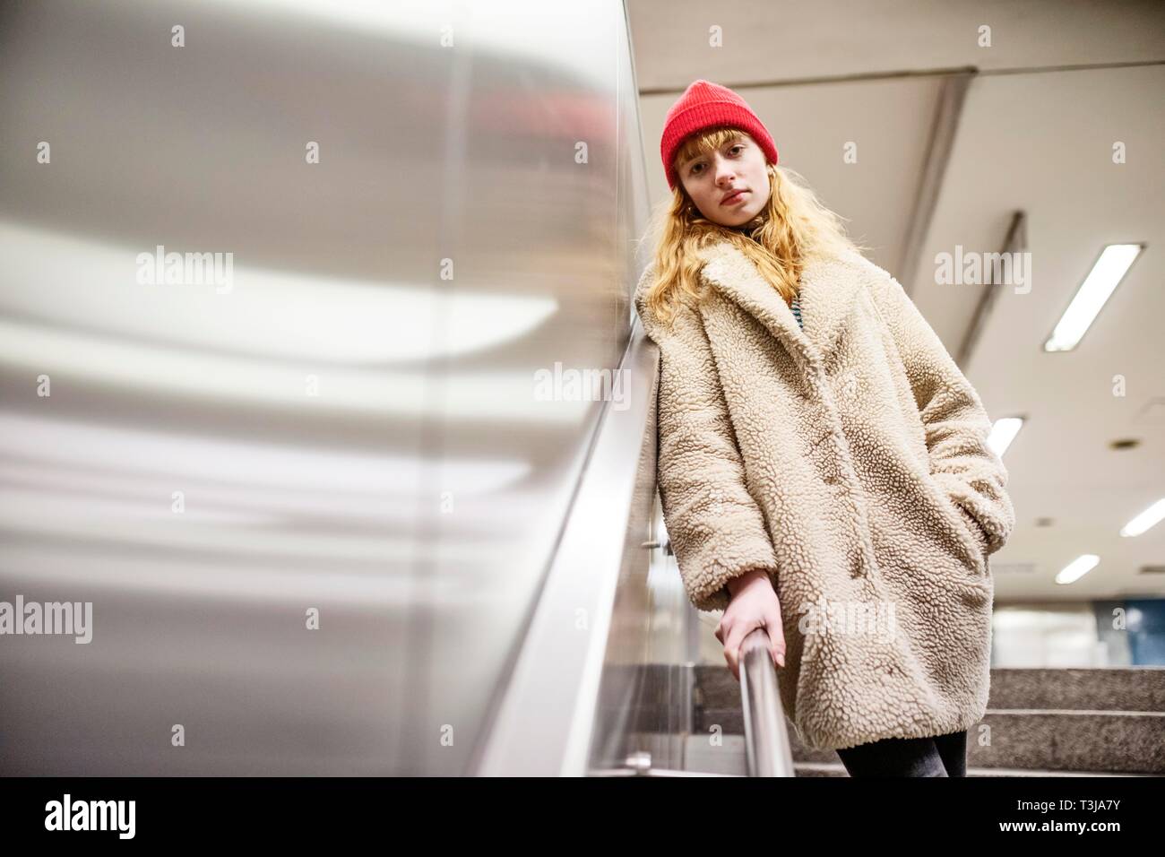 Girl, teenager, standing at the stairs of a subway station, Cologne, North Rhine-Westphalia, Germany Stock Photo