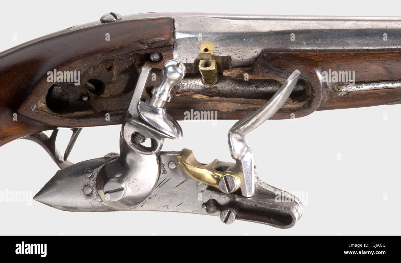 A Gendarmerie pistol M an IX, later used by a magician. Regulation model with iron mounts, brass pan and acceptance stamps. The ramrod guide equipped with small-calibre barrel in 5 mm calibre, ignition by a touch hole and a primer vent diagonally below the proper barrel, which the artist used for firing paper bullets. His partner pretended to catch the bullet with his mouth and used to present a genuine lead bullet which he had stuck in his mouth before, to the amazed spectators. Length 25 cm. Supposedly from the collection of the world famous ma, Additional-Rights-Clearance-Info-Not-Available Stock Photo