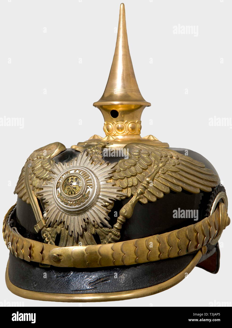 A helmet for an officer, of the Prussian Guard Train Battalion Black lacquered leather skull (age cracks) with gilt mountings, cambered metal chinscales, and guards eagle (worn by cleaning, pin resoldered) with a superimposed, silver-plated, enamelled star. Officer's cockades. The ribbed silk lining replaced. historic, historical, 19th century, Prussian, Prussia, German, Germany, militaria, military, object, objects, stills, clipping, clippings, cut out, cut-out, cut-outs, helmet, helmets, headpiece, headpieces, utensil, piece of equipment, utens, Additional-Rights-Clearance-Info-Not-Available Stock Photo