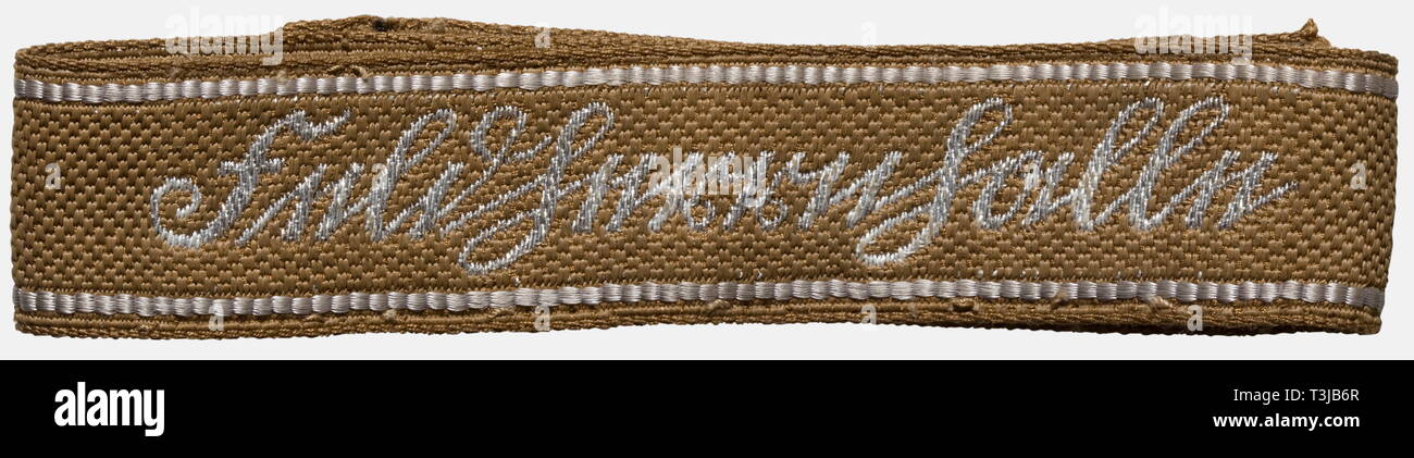 A cuff title for junior officers of the SA Standarte 'Feldherrnhalle', with award certificate Cuff title with silver-woven name designation in Sütterlin script (so-called 'flatwire') and borders of silver-grey artificial silk. Length about 41 cm. Included is the award certificate, Nr. 762 dated 11 September 1944 with original ink signature of Brigadeführer Kübler. historic, historical, 1930s, 20th century, storm battalion, stormtroopers, armed and uniformed branch of the NSDAP, organisation, organization, organizations, organisations, NS, National Socialism, Nazism, Third R, Editorial-Use-Only Stock Photo
