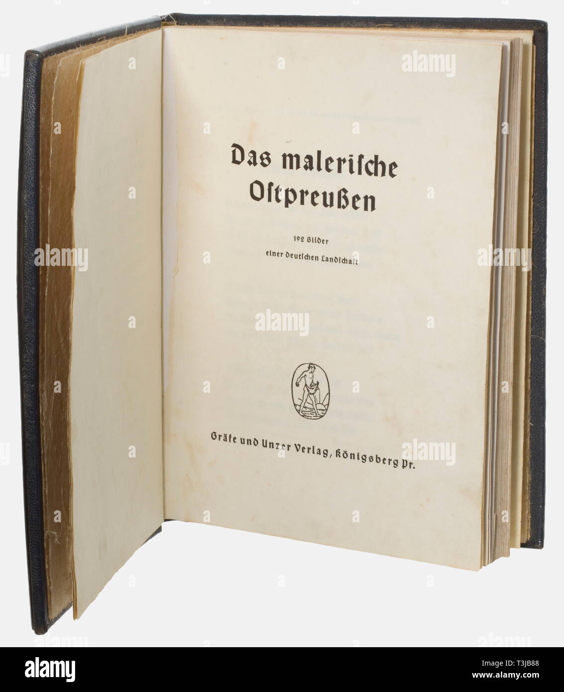 A deluxe edition 'Das malerische Ostpreußen', from a distinguished German amber collection Illustrated book on East Prussia with 122 photographs and a preface by Gauleiter Erich Koch. 215 pages (partially damaged/spotted/one missing?), publ. by Gräfe und Unzer, Königsberg, no date. Blue leather cover, the front applied with a silver plaque bearing an amber panelled image of East Prussia with the engraved portrayal of Königsberg, the silver plaque also engraved, offshore the coast of East Prussia three cogs and a horse cart coming from West Prussia protected by knights. The , Editorial-Use-Only Stock Photo