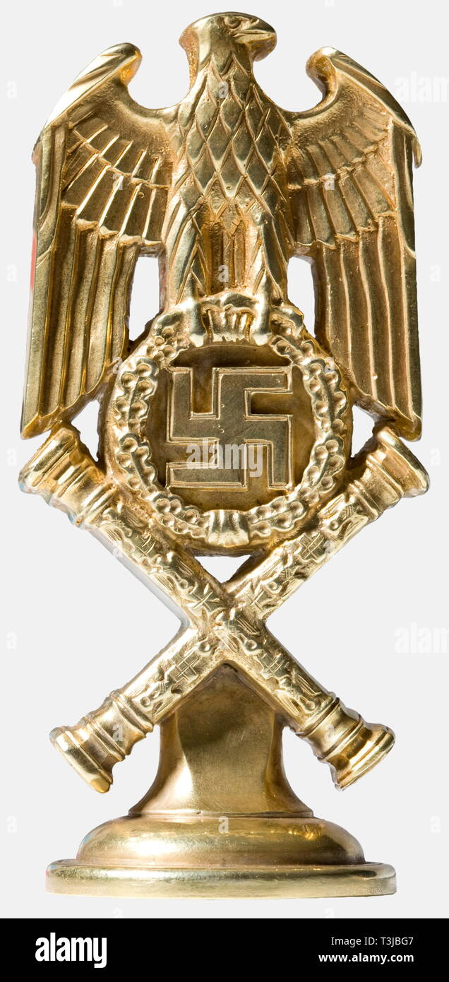 Hermann Göring, his personal seal as Reich Marshal Fashioned in solid silver and gilt. The shape of the seal is that of the shoulder board design of a Reich Marshal's uniform i.e., a national eagle with half-spread wings above an oak leaf wreath with swastika and the crossed Reich Marshal's batons. The seal face is carved with the great, helmeted Göring family coat of arms with the surrounding inscription 'Reichsmarschall Hermann Göring'. Deeply struck on the reverse is the mark of the Berlin jeweller Herbert Zeitner and mark of fineness '925' with crescent moon and crown. , Editorial-Use-Only Stock Photo