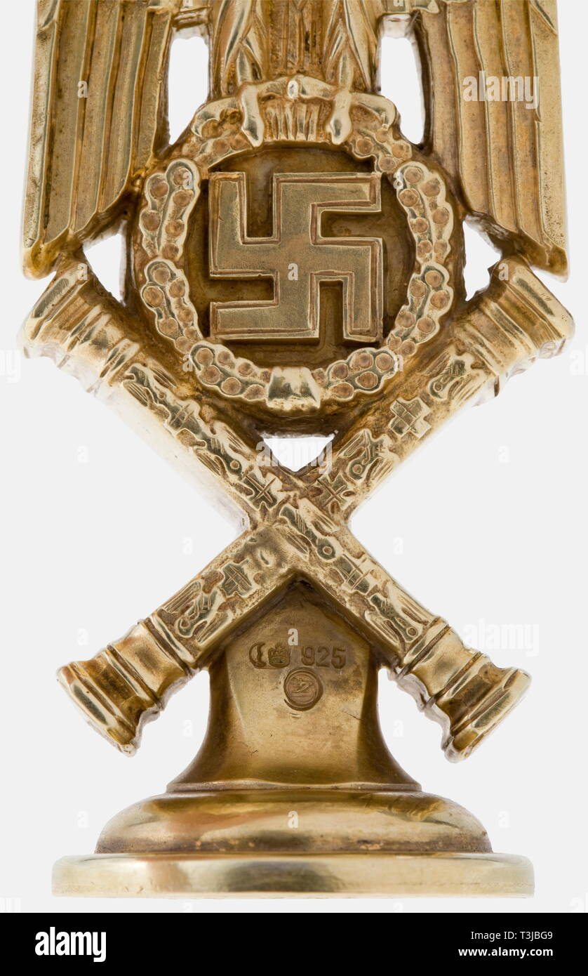 Hermann Göring, his personal seal as Reich Marshal Fashioned in solid silver and gilt. The shape of the seal is that of the shoulder board design of a Reich Marshal's uniform i.e., a national eagle with half-spread wings above an oak leaf wreath with swastika and the crossed Reich Marshal's batons. The seal face is carved with the great, helmeted Göring family coat of arms with the surrounding inscription 'Reichsmarschall Hermann Göring'. Deeply struck on the reverse is the mark of the Berlin jeweller Herbert Zeitner and mark of fineness '925' with crescent moon and crown. , Editorial-Use-Only Stock Photo