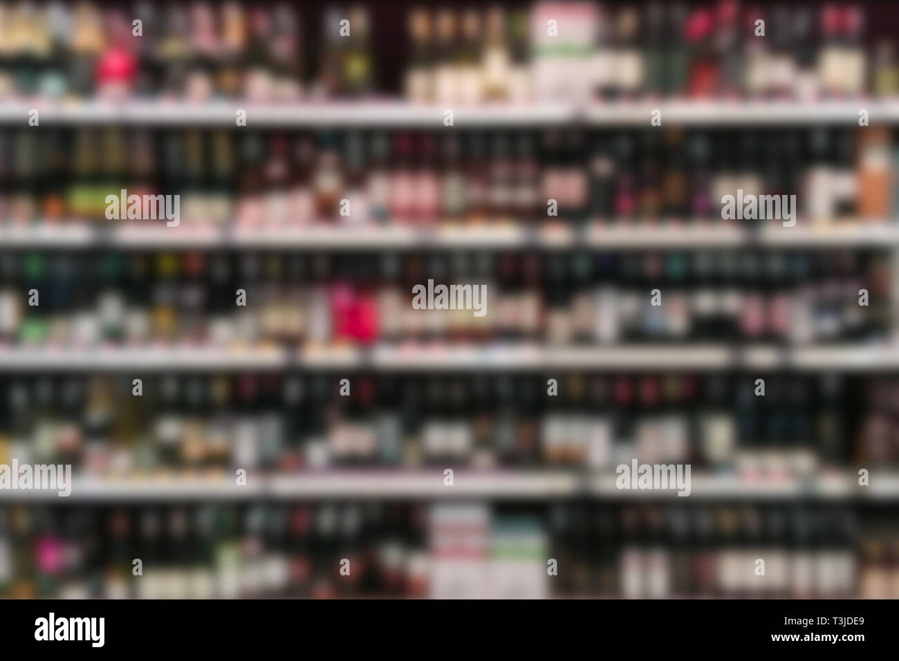blur liquor store shelf in super market for background Stock Photo