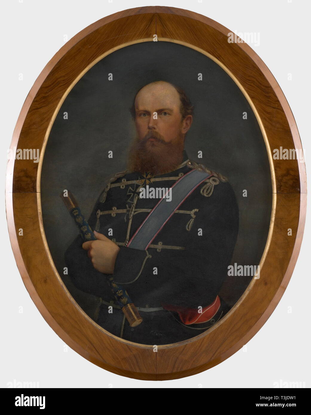 Prince Frederick Charles of Prussia (1828 - 1885), a portrait of the Field Marshal, ca. 1872 Oil on canvas in vertical oval stretcher. Half portrait of the commander in the uniform of the 1st Life Hussar Regiment No. 1 with bandoleer across his chest. Holding in his left hand a marshal's baton, around his neck the Pour le mérite and the Grand Cross of the Iron Cross. On the lower edge the hardly legible signature 'M. Kuppenz(?)'. Oval wood frame with burl veneer. Ca. 114 x 92 cm. Prince Frederick Charles of Prussia, nephew of Kaiser Wilhelm I, wa, Additional-Rights-Clearance-Info-Not-Available Stock Photo