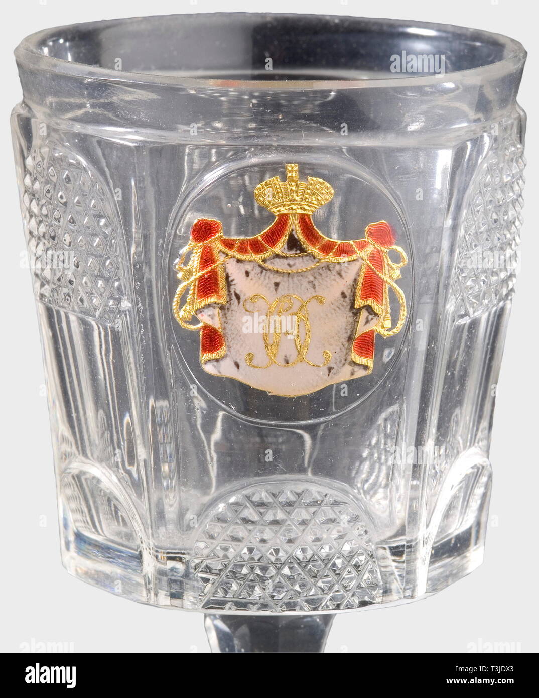 A dessert wine glass, Imperial Russian Glass Manufactury St. Petersburg, circa 1840 Crystal glass with the Russian monogram on the front in enamelled and hand painted 'Zwischengold'-glass technique, the letters 'ON' on an ermine canopy beneath the grand ducal coronet. Gilt on the back. Faceted stem, round base with a cut star on the bottom. Height 10.5 cm. From the drink service by the Imperial Glass Manufactory which, consisting of 100 settings, was commissioned by Tsar Nicholas I on the occasion of Grand Duchess' Olga's 18th birthday in 1840 fo, Additional-Rights-Clearance-Info-Not-Available Stock Photo