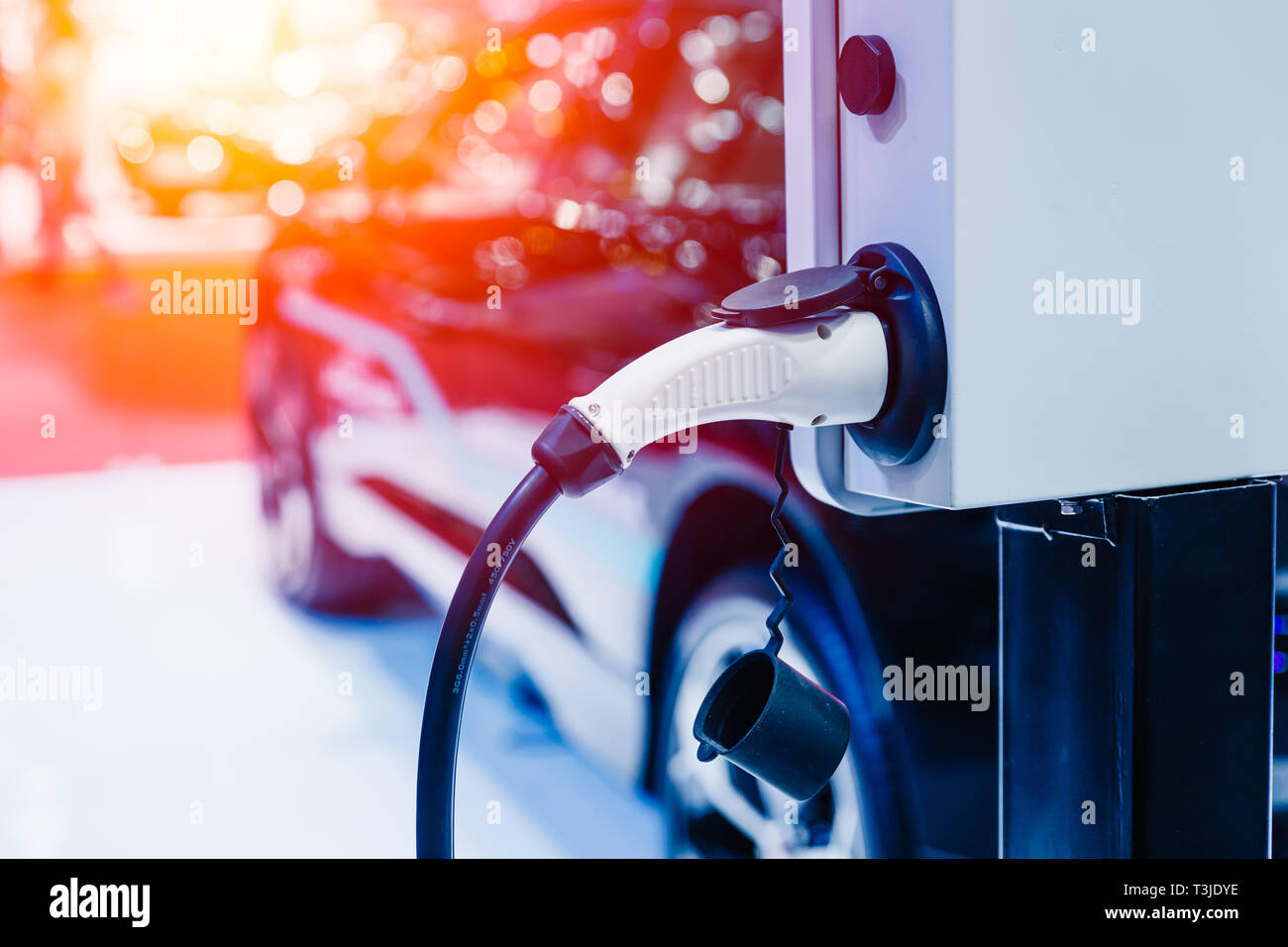closeup electricity eco car at charging station future for driving concept. Stock Photo