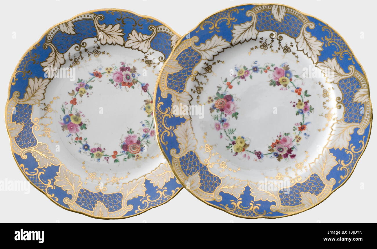 Two plates from the dowry, Imperial Russian Porcelain Manufactory St. Petersburg White, glazed porcelain, the light blue border with golden cartouches and leaves decoration, in the centre hand-painted flower décor. On the bottom steel blue underglaze mark 'N I' of the Imperial Manufactory St. Petersburg, one plate with the monogram 'R'. Diameter 25 cm. In addition one original protective cover made of light rose-coloured velvet. This service was a present of her father Tsar Nikolas I and part of her dowry. Of excellent preservation and workmanshi, Additional-Rights-Clearance-Info-Not-Available Stock Photo