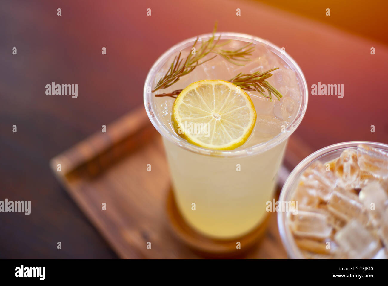 ice lemon soda juice on wooden table. fresh fruite drink for hot summer season. Stock Photo