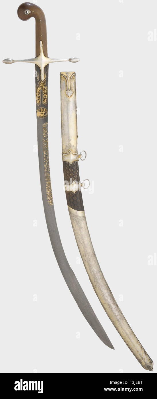 An Ottoman silver-mounted kilij, 17th/19th centuries Curved single-edged blade (1st half of the 17th century) of beautifully figured wootz-Damascus with a broadened, double-edged point. The obverse side bears a long inscription from the Koran, inlaid in gold, surrounded by the 'Basmala' (first verse of the Koran), and followed by two inscription cartouches and the signature, 'Haji Sungar's work'. Silver quillons and grip frame with riveted rhinoceros horn grip scales. Wooden scabbard, wound with cord, the middle covered with shagreen leather and , Additional-Rights-Clearance-Info-Not-Available Stock Photo
