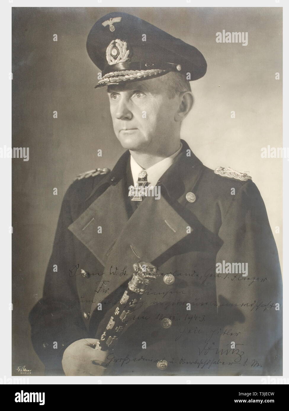 General der Flieger Friedrich Christiansen, a presentation photograph of Grand Admiral Dönitz for his birthday in 1943 An oversized portrait photograph of Dönitz in uniform and cloak as Grand Admiral with the Knights Cross and Oak Leaves, and his Grand Admiral's baton in his right hand. The photographer's illuminated signature is at the lower left, 'F. Bauer, Berlin'. The dedication is in ink at the bottom edge, 'Dem W.B. Niederlande, Gen d. Flieger Christiansen zum Geburtstag in getreuer Kameradschaft am 12. XII. 1943. Heil Hitler - Dönitz Großadmiral u. Oberbefehlhaber d., Editorial-Use-Only Stock Photo