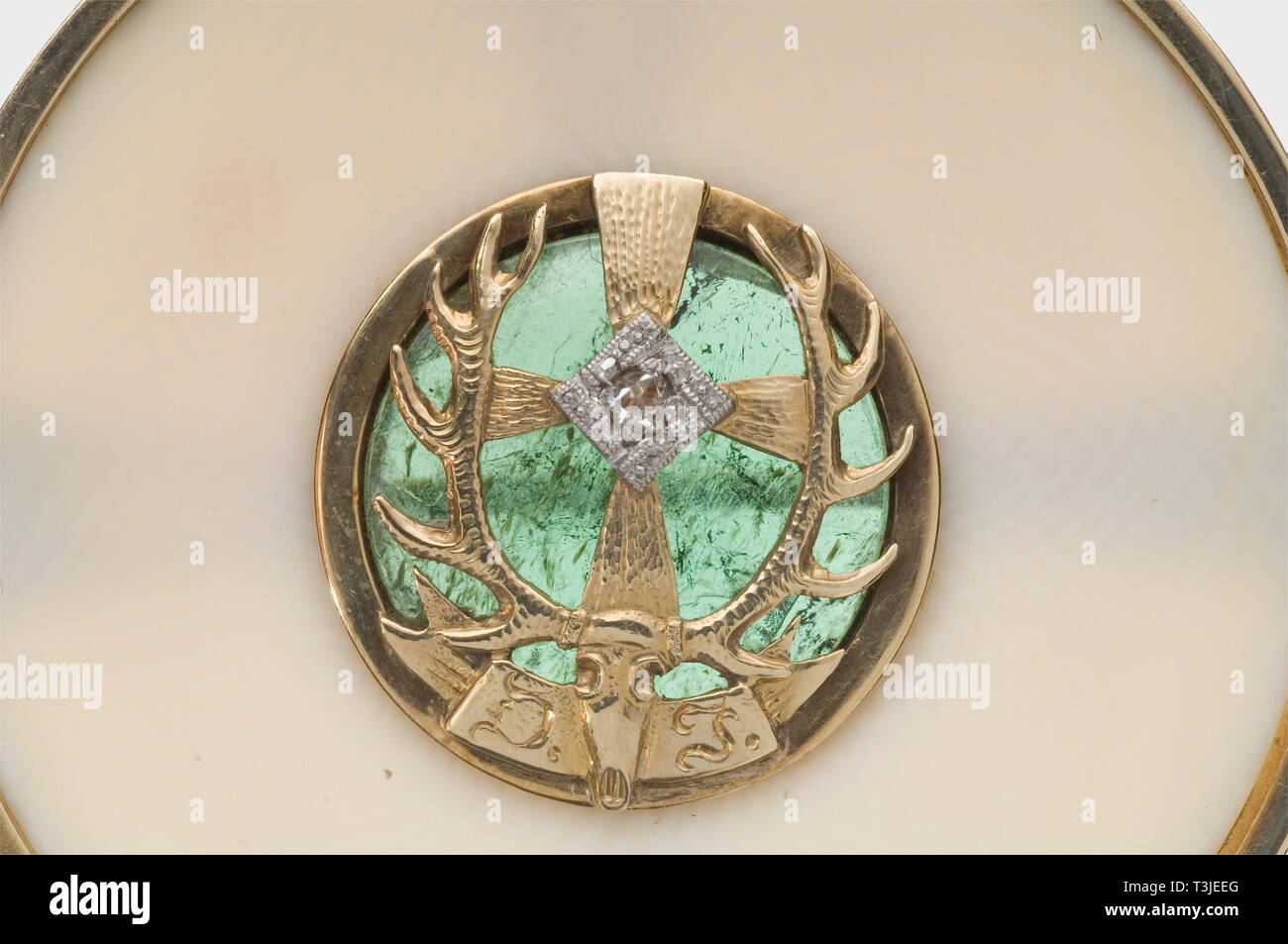 Hermann Göring, House Order of Carinhall Gold, platinum, ivory, diamond, and tourmaline. In the centre an openwork St. Hubert's deer head of gold, with diamond studded swastika and monogram "D.J." over tourmaline set à jour. The back with fastening pin. Diameter 43 mm, weight 14.5 g. The monogram refers to the Reichsbund Deutsche Jägerschaft (German Hunting Association), which was subordinate to Hermann Göring as "Reichsjägermeister" (Master Huntsman of the Reich). The House Order of Carinhall was a hunting order awarded by Hermann Göring in Carinhall to female relatives or, Editorial-Use-Only Stock Photo