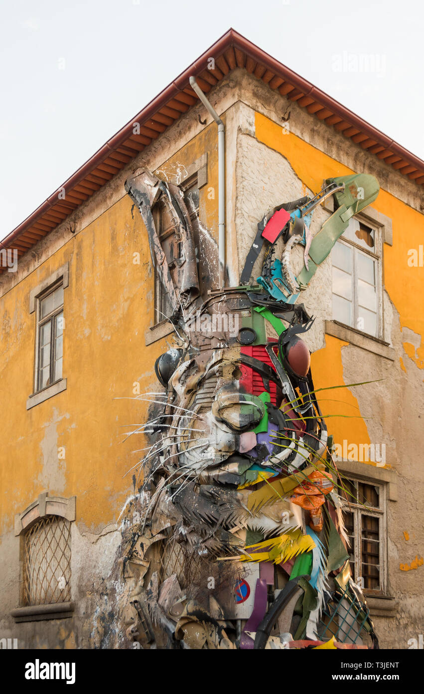 Half Rabbit by Bordalo II is a street art installation in Porto, Portugal!  Stock Photo - Alamy