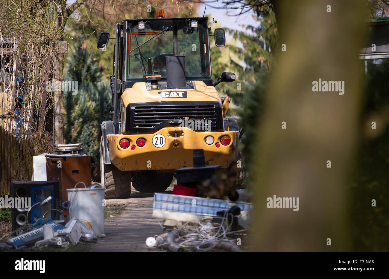 Lügde, Germany. 10th Apr 2019. Furnishings and a loader are to be seen in front of the plot of the alleged perpetrator on the camping site Eichwald in the district Elbrinxen. The campsite operator has the crime scene torn down. At the camping site in Lügde, a 56 year old campervan with an accomplice is said to have abused and filmed children for years. Photo: Friso Gentsch/dpa Credit: dpa picture alliance/Alamy Live News Stock Photo
