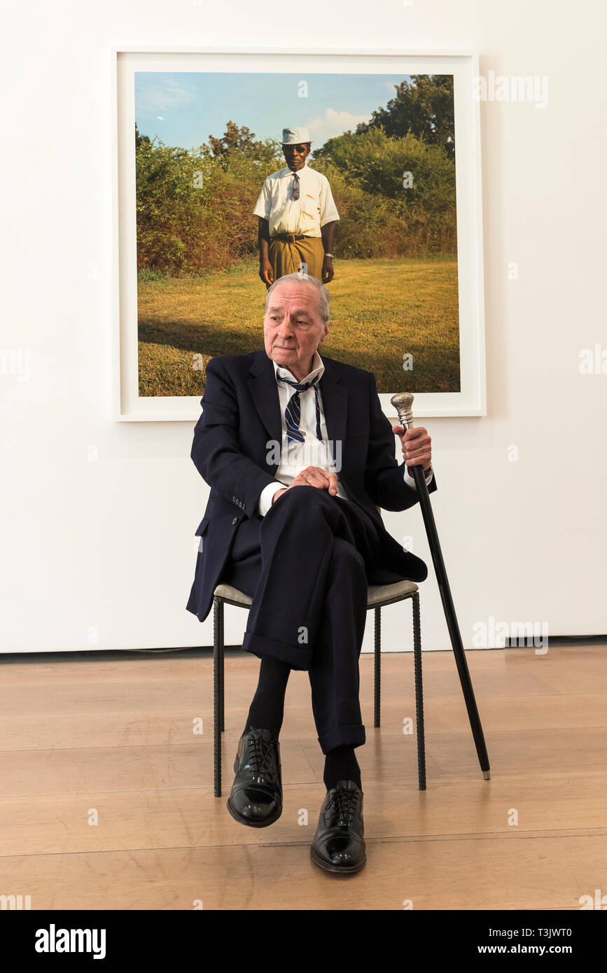 London, UK.  10 April 2019.  American photographer William Eggleston poses in front of one of his works from his new exhibition '2¼' at the David Zwirner gallery in Mayfair.  The show comprises a series of square-format colour photographs taken around 1977 throughout California and the American South and will run April 12 to June 1, 2019.  Credit: Stephen Chung / Alamy Live News Stock Photo