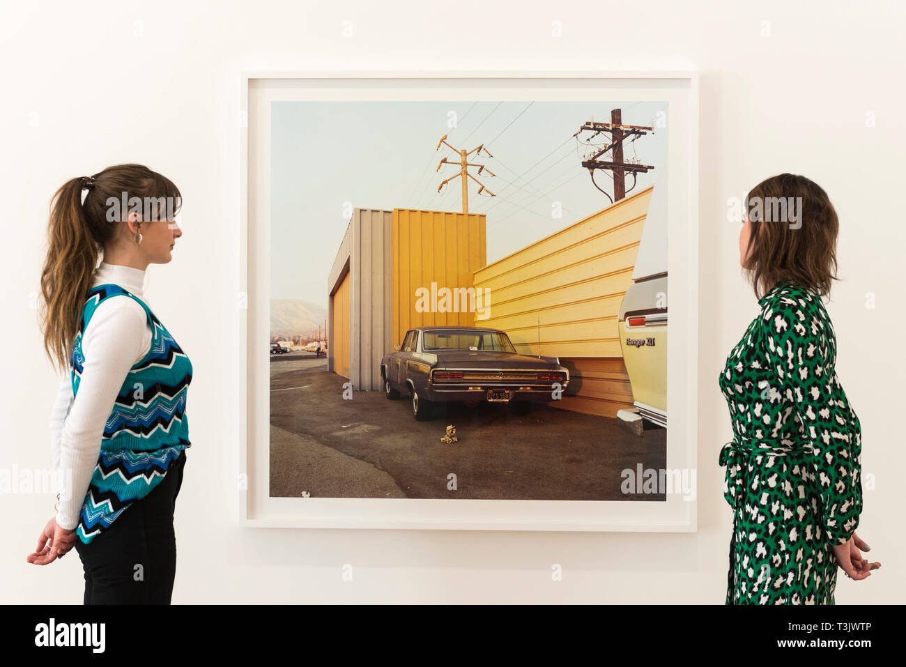 London, UK.  10 April 2019.  Staff members view a work by American photographer William Eggleston at his new exhibition '2¼' at the David Zwirner gallery in Mayfair.  The show comprises a series of square-format colour photographs taken around 1977 throughout California and the American South and will run April 12 to June 1, 2019.  Credit: Stephen Chung / Alamy Live News Stock Photo