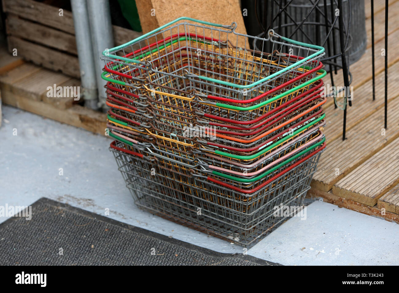 General view of a stack of shopping baskets in a vintage shop in Brighton, East Sussex, UK. Stock Photo