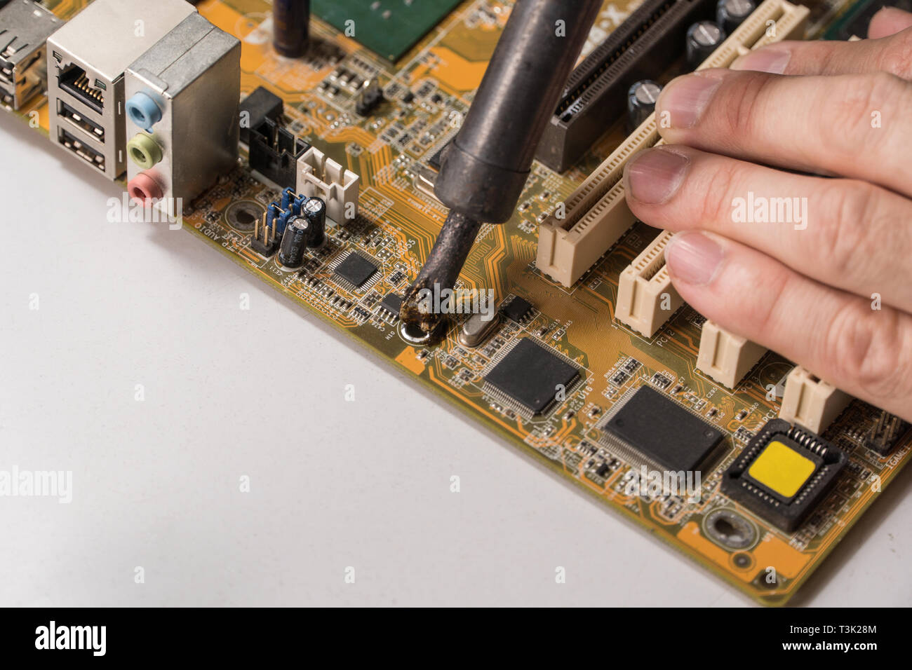 technician electronic soldering and repairing computer chip Stock Photo Alamy