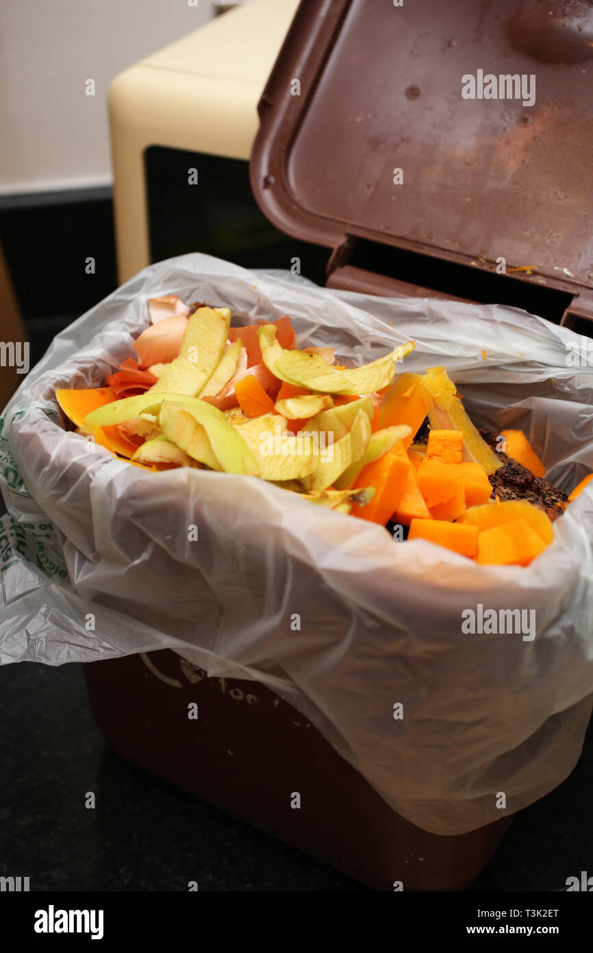 General views of food waste being collected for a brown food waste recycling box in a home in Southampton, Hampshire, UK. Stock Photo