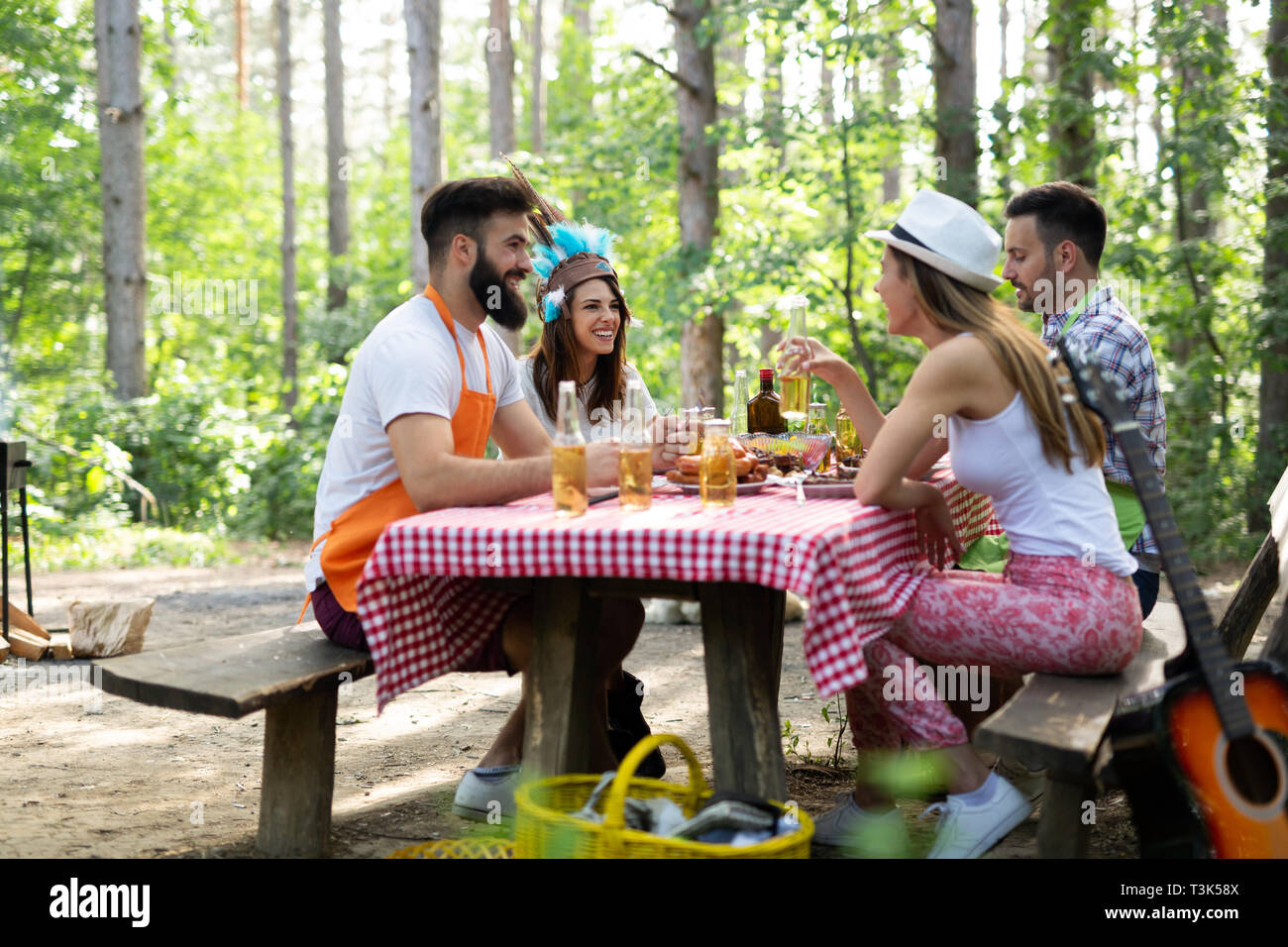 Group of happy friends having a barbecue party in nature Stock Photo ...