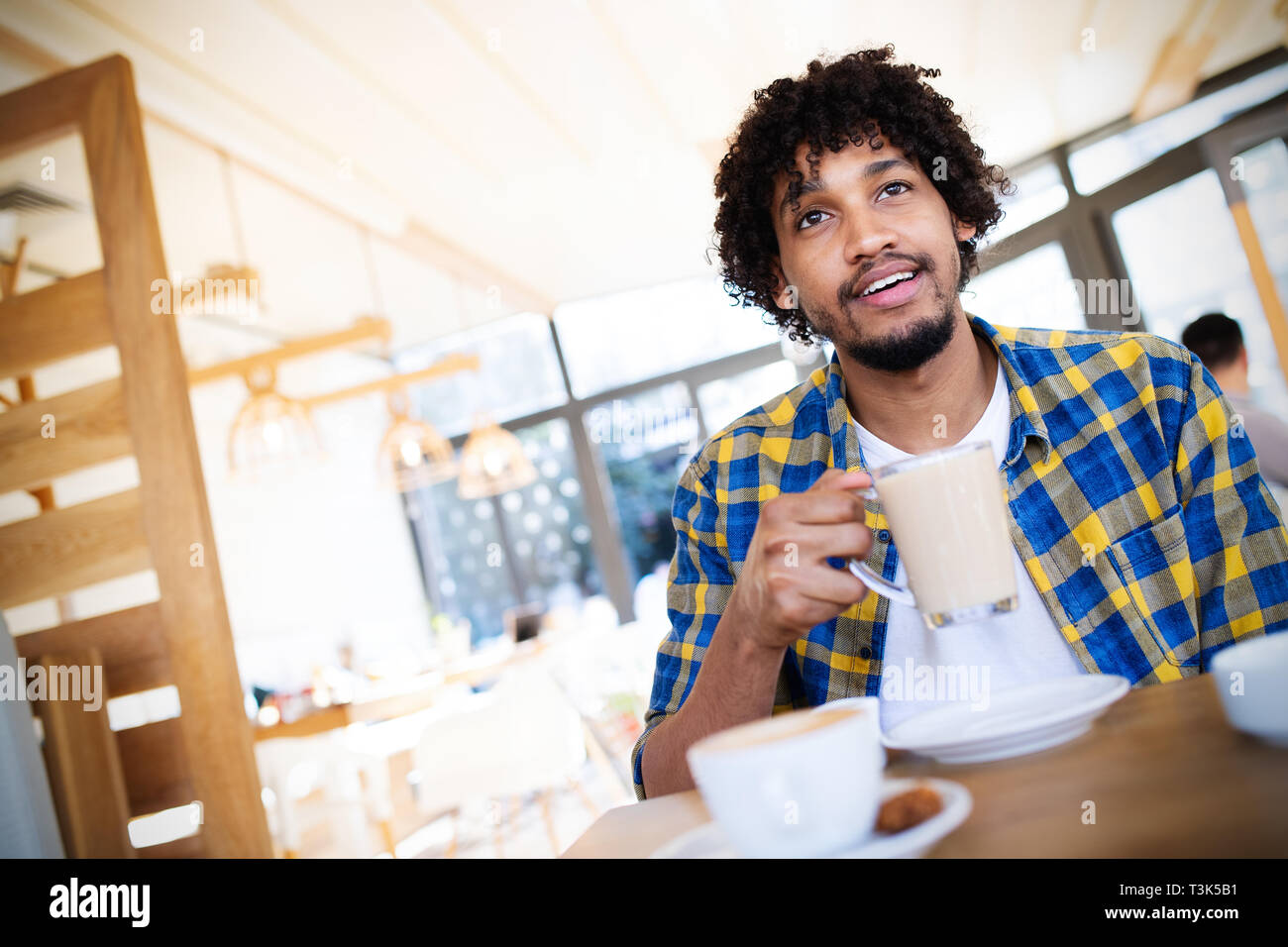 African man afro holding young hi-res stock photography and images - Alamy