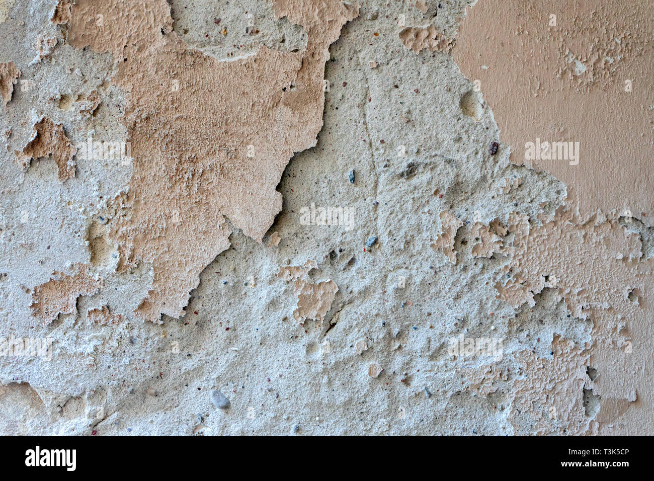 Oldgrungy weathered wall background texture. Dirty peeled plaster wall