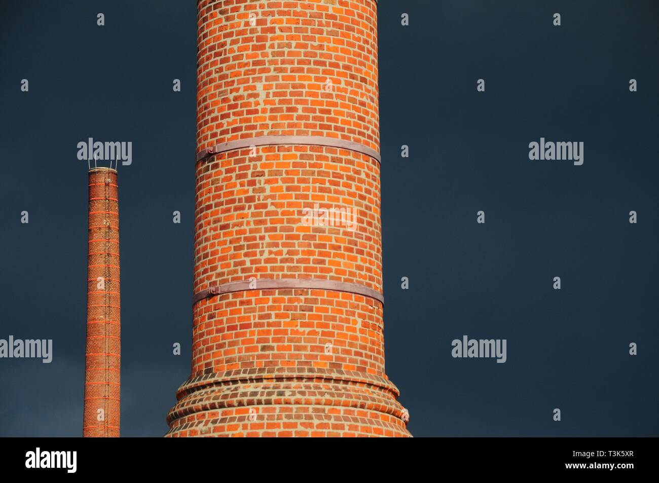 Factory chimney in front of thunderclouds, Germany, Europe Stock Photo