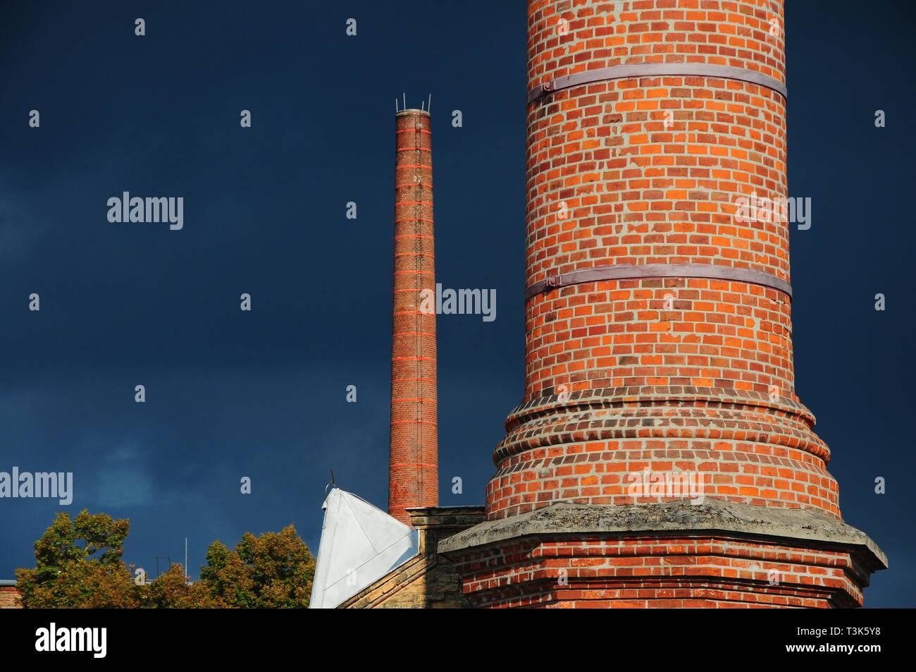 Factory chimney in front of thunderclouds, Germany, Europe Stock Photo