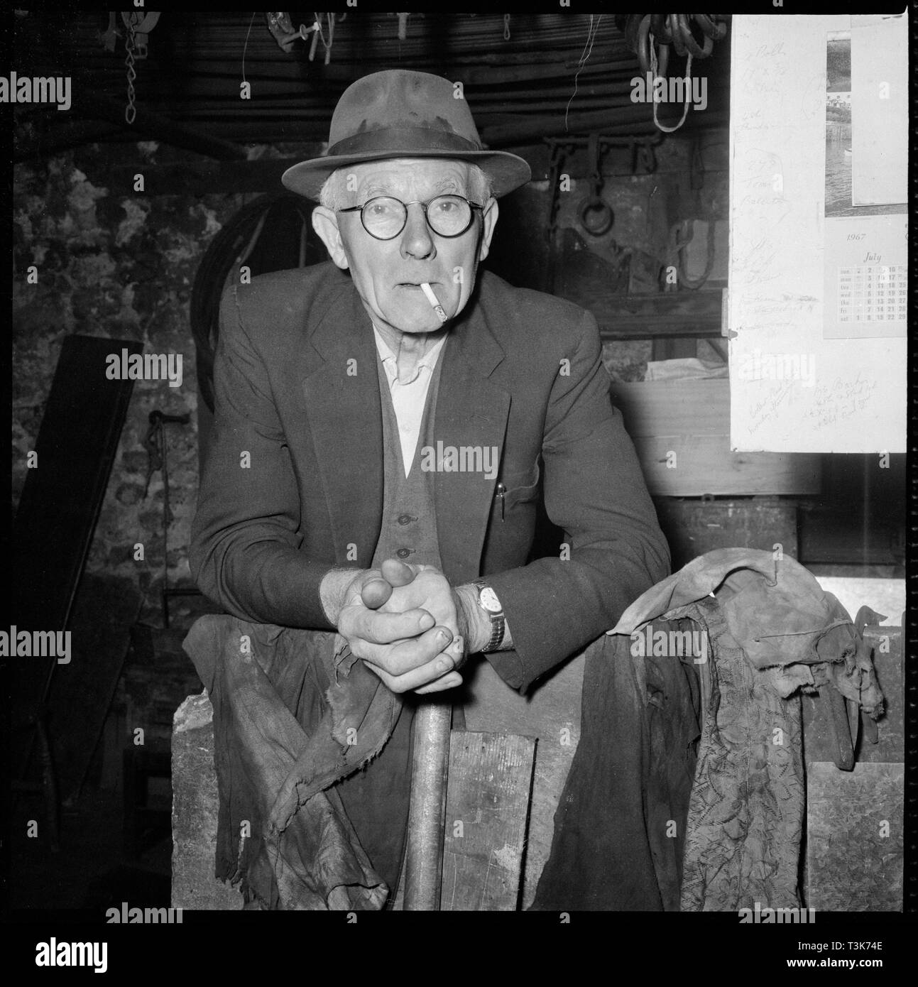 Elderly man posed in a workshop, 1967. Creator: Eileen Deste. Stock Photo