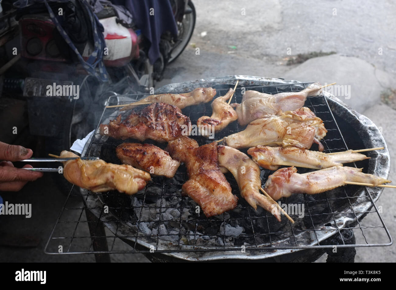 Thai street food chicken grilled Stock Photo - Alamy