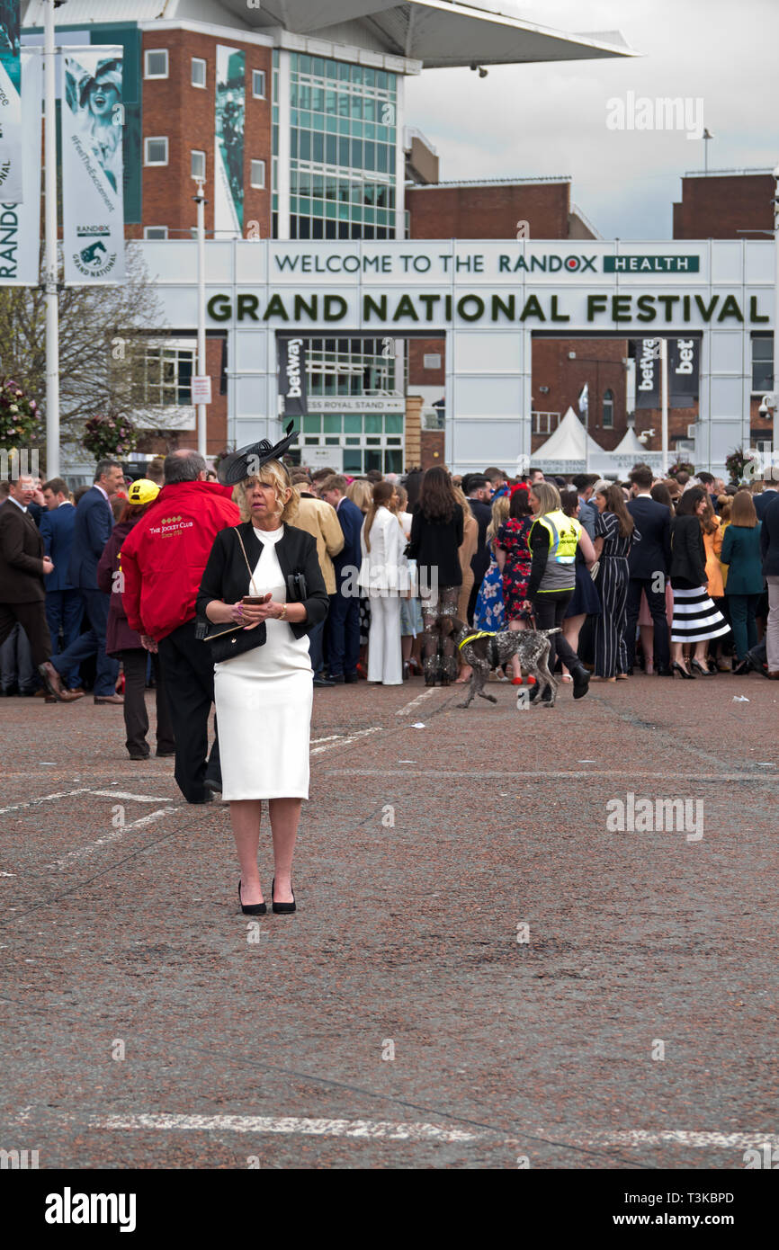 Women dress up for a day out on Ladies Day at the 2019 Aintree Grand National Meeting Stock Photo