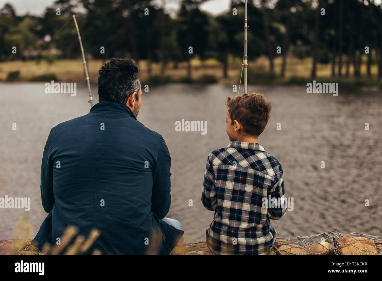 Father and child fishing together hi-res stock photography and