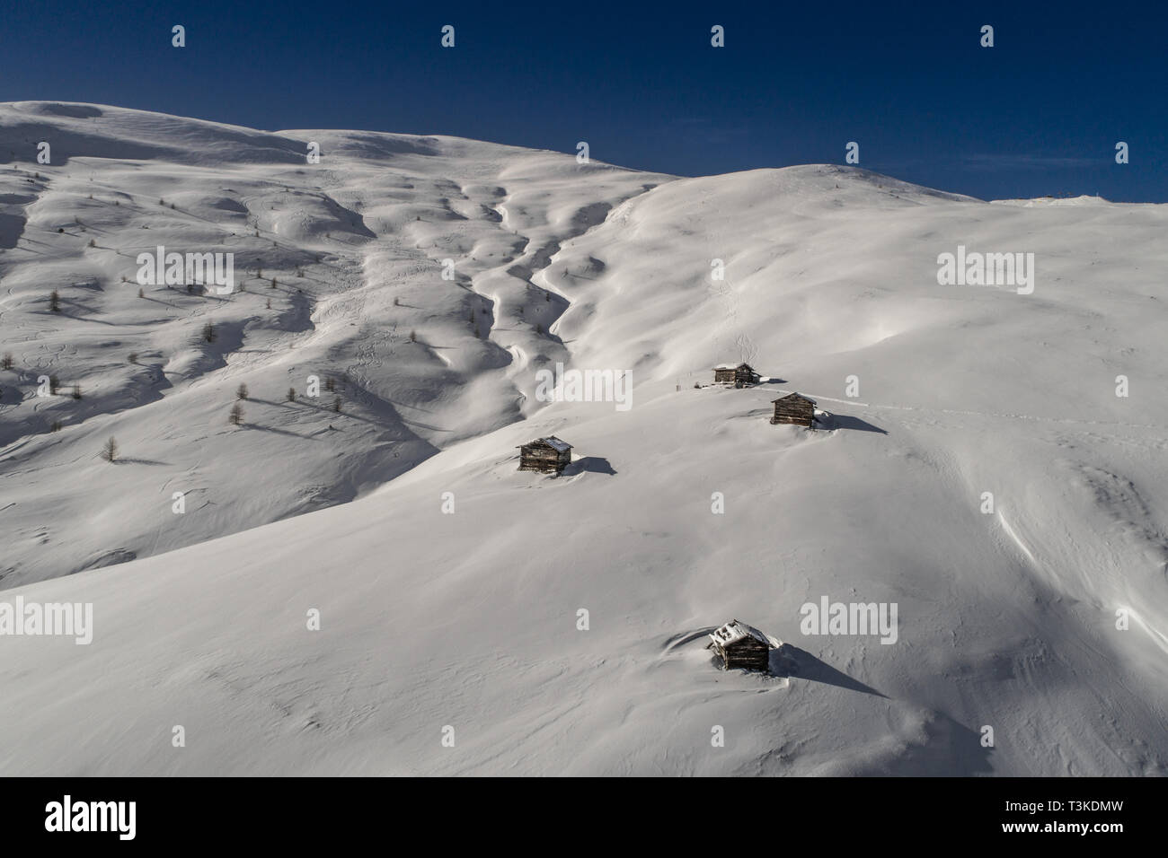 Chalets in mountain covered with snow. Winter landscape Stock Photo