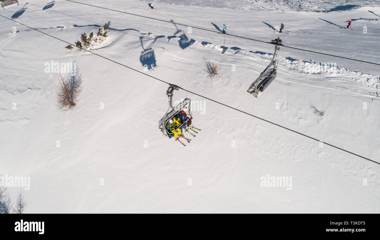 Skiers on skilift view from above. Ski resort in Europe Stock Photo