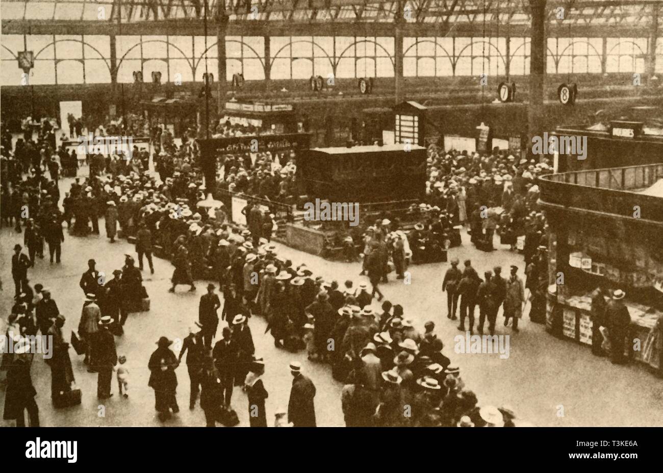 'A Queue of Holiday-Makers Waiting for Trains at Waterloo Station, London', 1930. Creator: Alfieri. Stock Photo