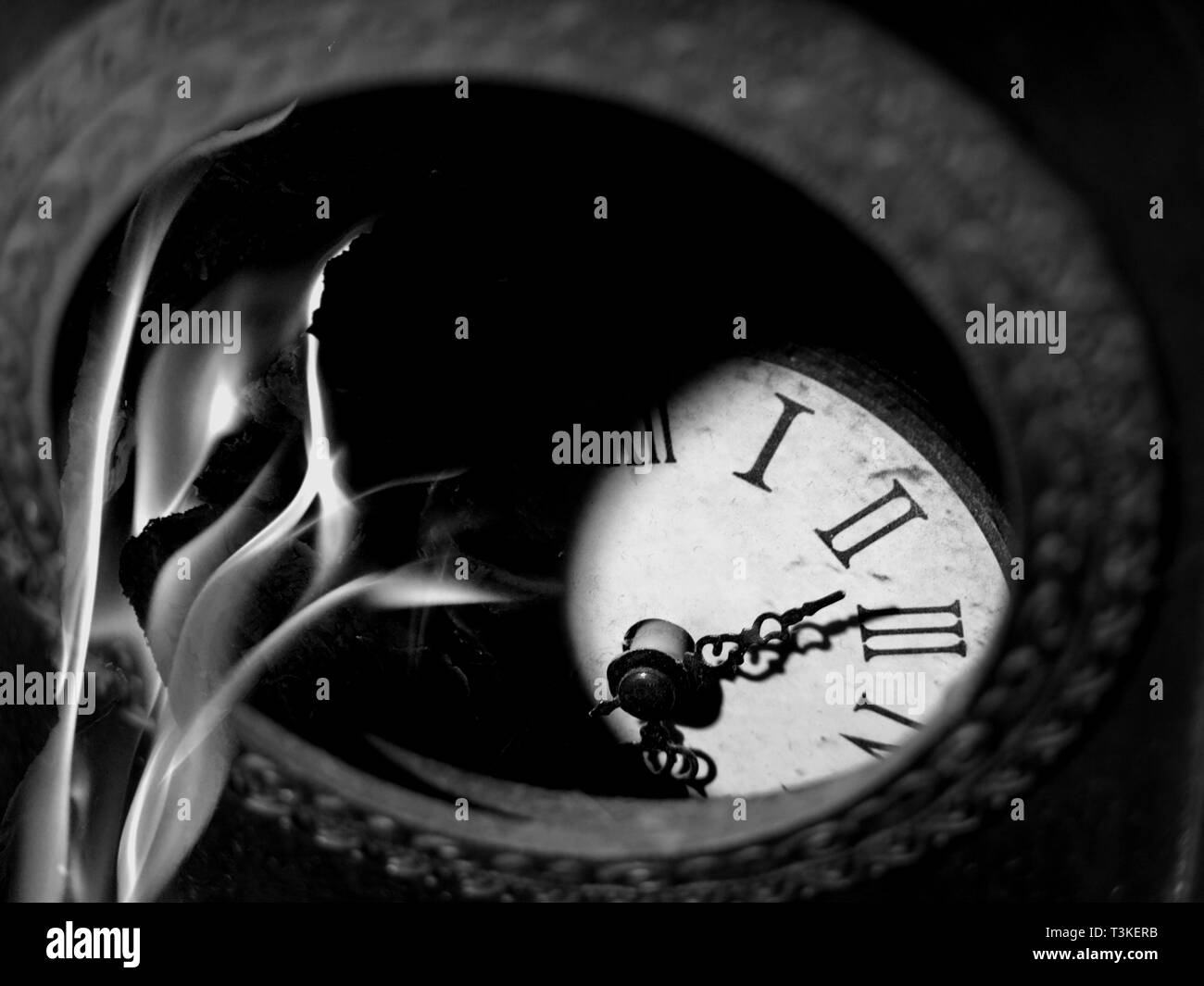Broken clock on fire Stock Photo Alamy