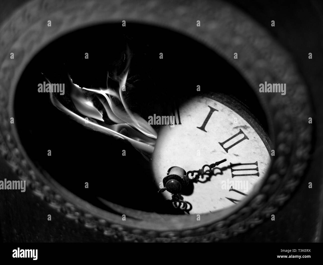 Broken clock on fire Stock Photo Alamy