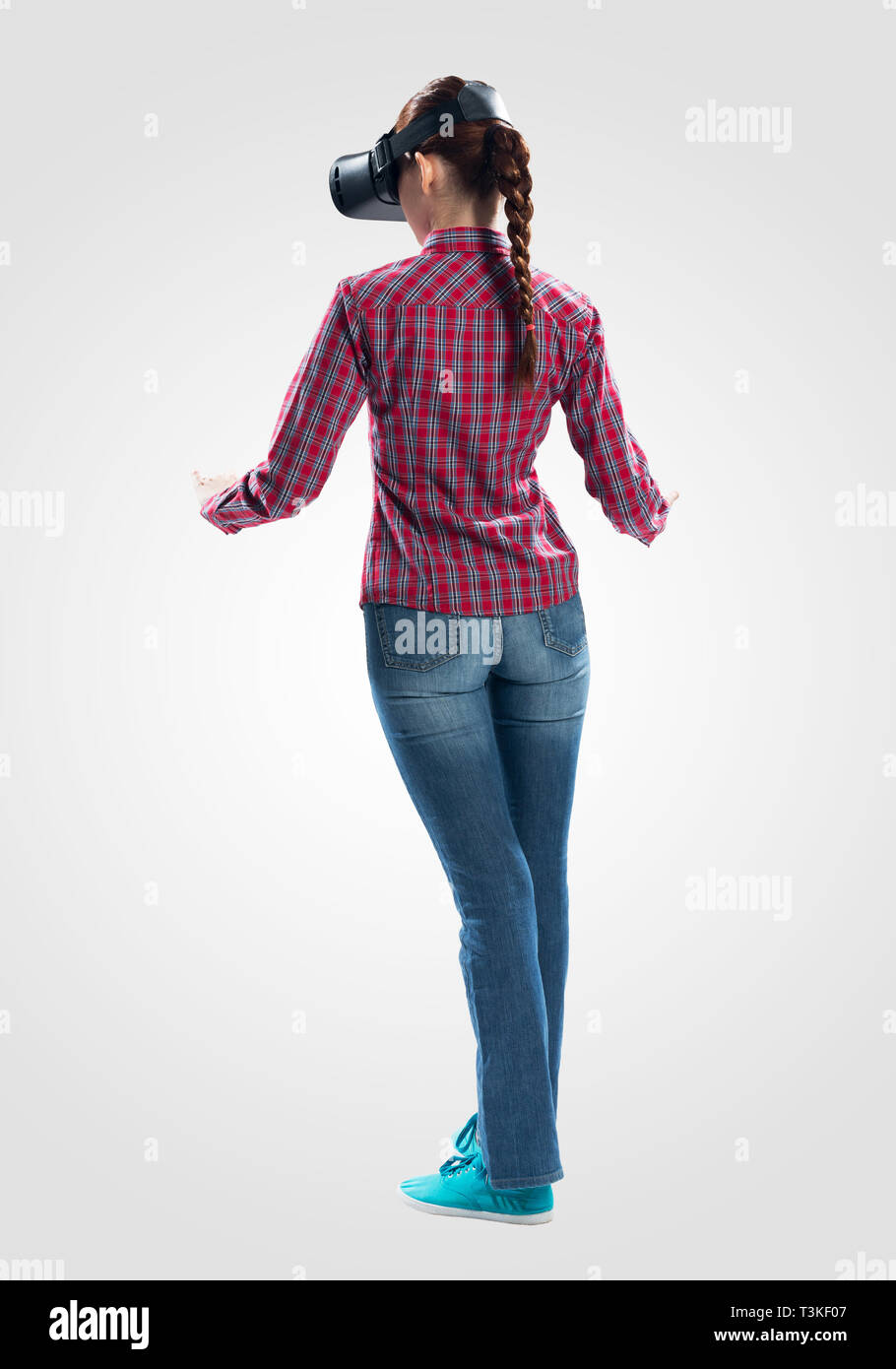 Woman wearing VR headset and gesturing in air Stock Photo