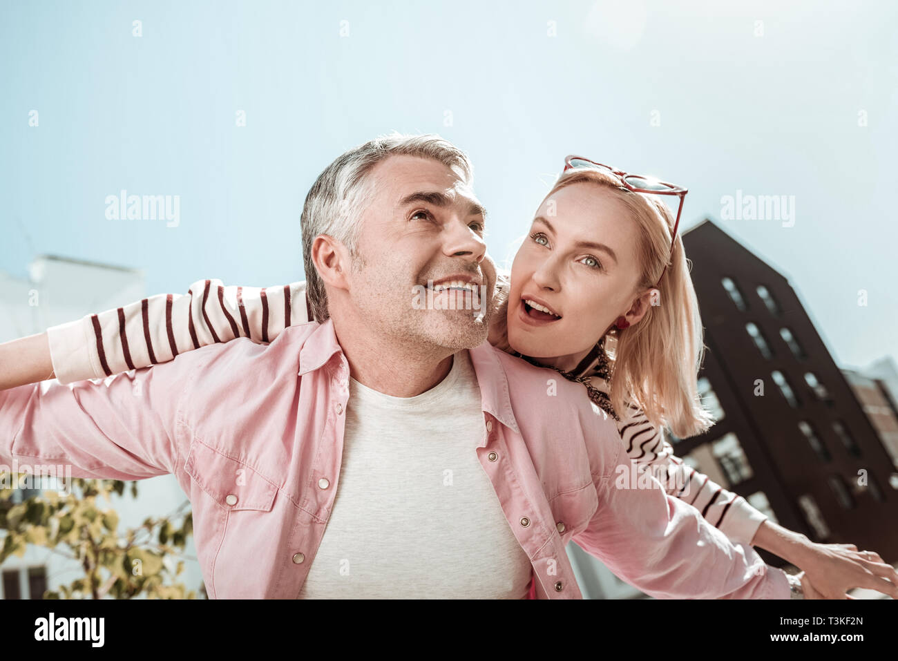 Low angle of a positive happy couple Stock Photo