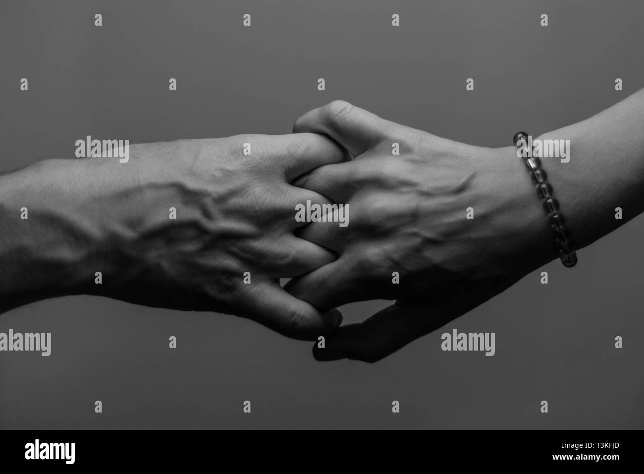 Young man shaking hand old hi-res stock photography and images - Alamy
