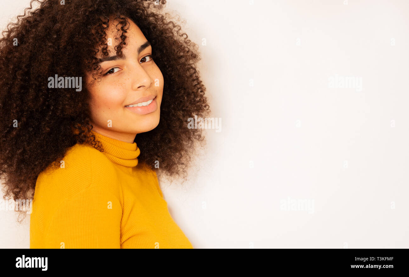 Young woman with beautiful smile and curly hair Stock Photo - Alamy